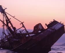 A rusty abandoned shipwreck in the sea