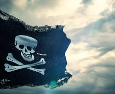 A photograph of a pirate flag in the wind