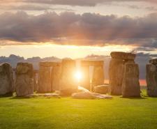 Stonehenge with the sun rising behind it