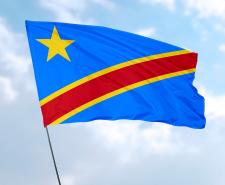Flag of Democratic Republic of the Congo in front of blue sky