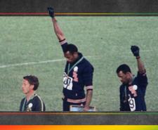 A photograph showing Tommie Smith and John Carlos raising their fist on the podium