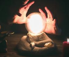 Crystal ball and fortune teller hands. Divination concept. The spiritual seance. Future reading.