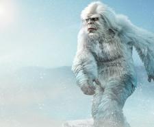 A Yeti strides across a snowy plain