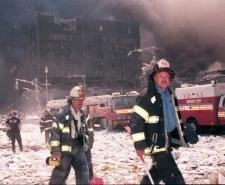 New York City firefighters walk near the area known as Ground Zero after the collapse of the Twin Towers